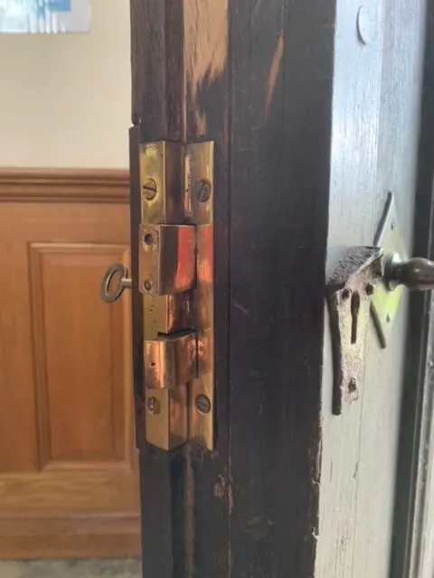 The rebuilt church door lock with hand cut bridge ward key