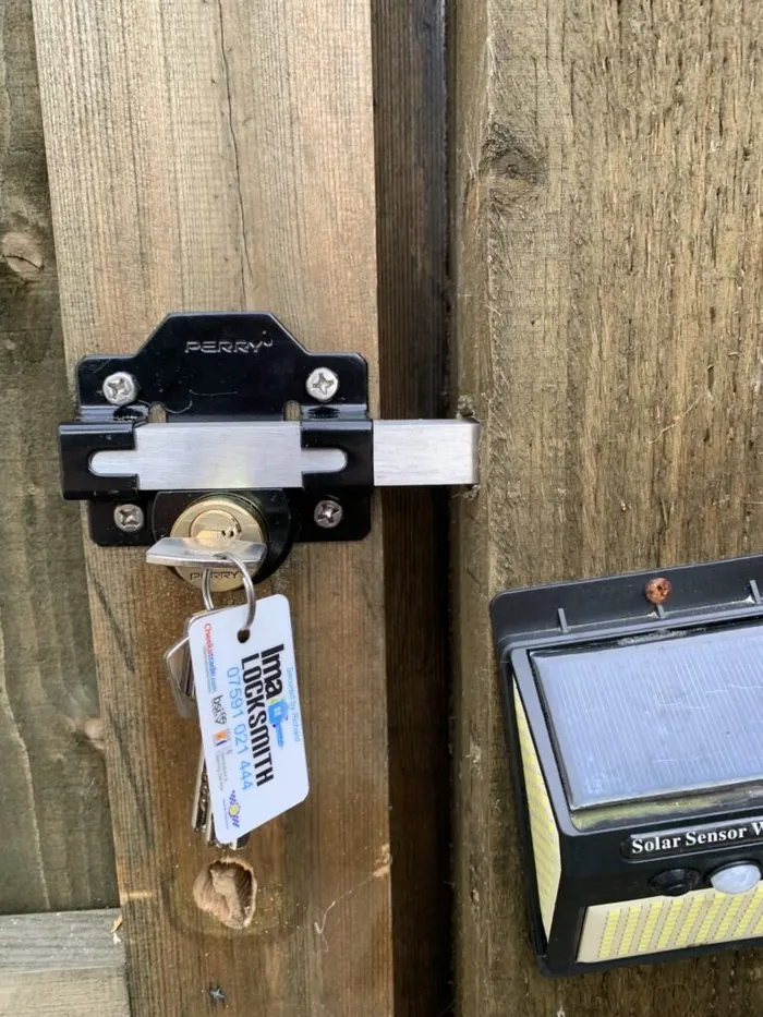 Long throw gate lock with IMA Locksmith branded keys fitted to a garden gate