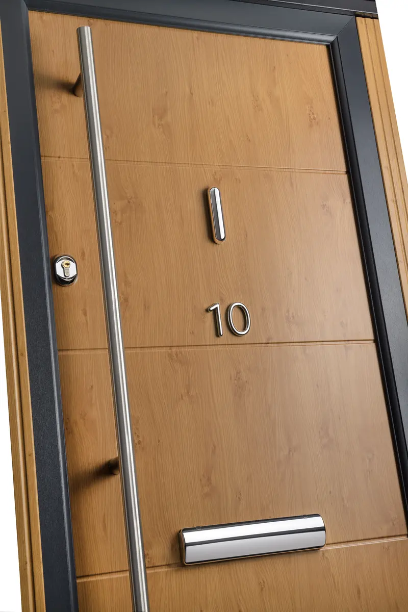 Modern oak effect composite door with long stainless pull handle, chrome cylinder and letterbox